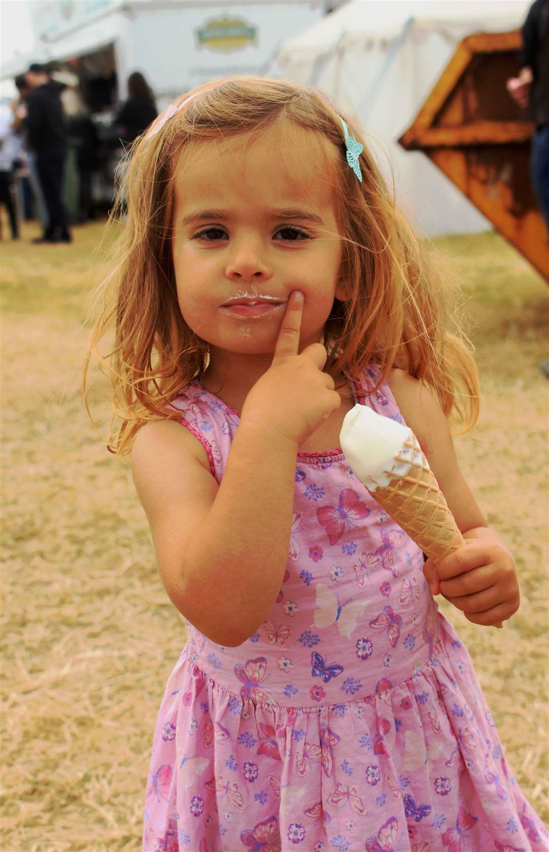 Arabella Sutherland (3) from Lybster enjoying an ice cream at the County Show. Picture: Alan Hendry