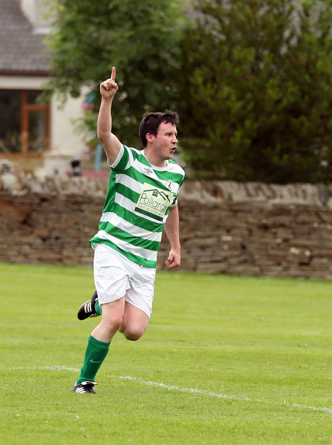 Michael Smith celebrates scoring the opening goal in Castletown's 2-0 win against Lochinver. Picture: James Gunn