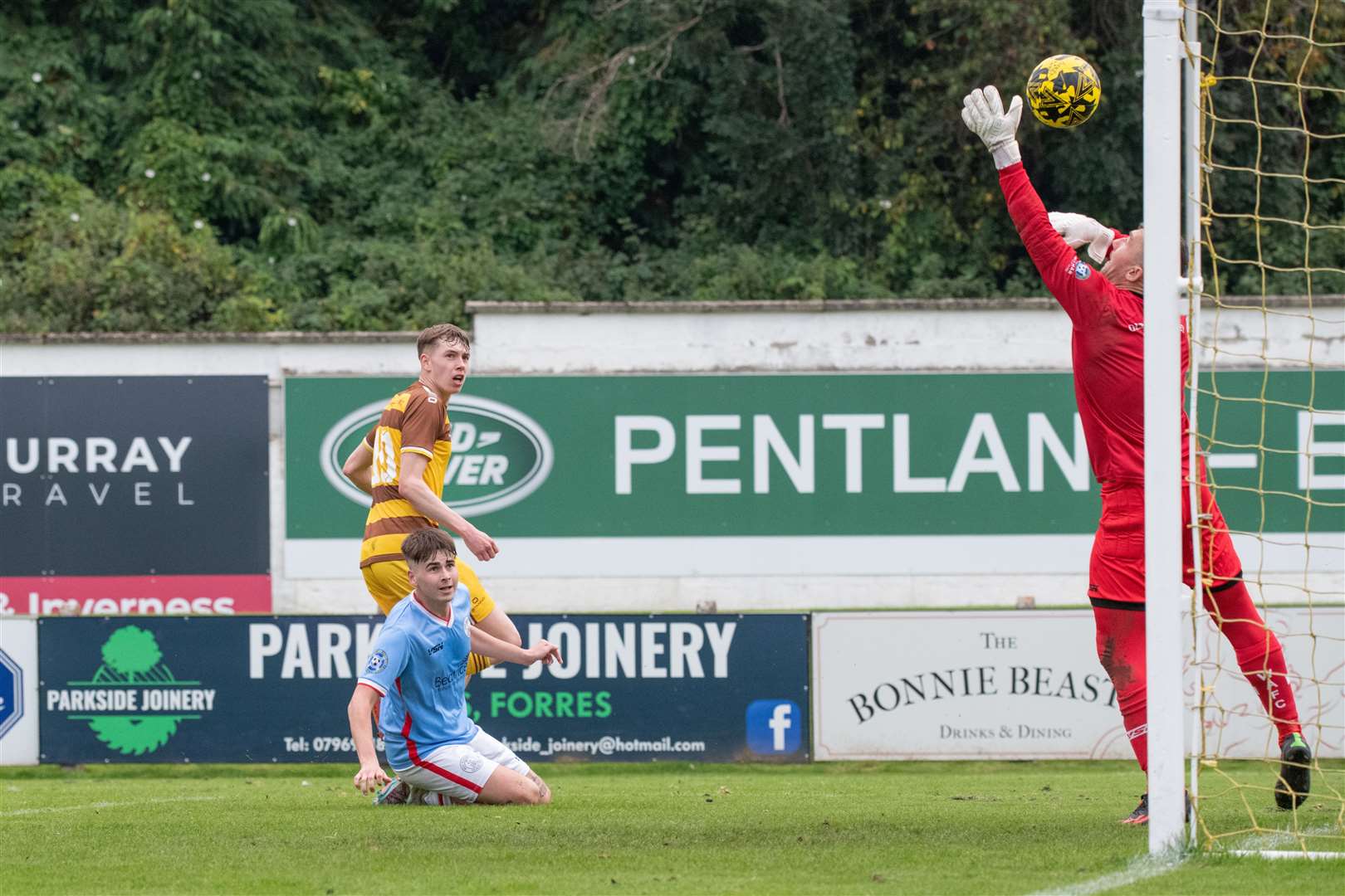 Calum Frame watches his shot fly past Wick keeper Graeme Williamson to make it 4-3 for Forres. Picture: Daniel Forsyth