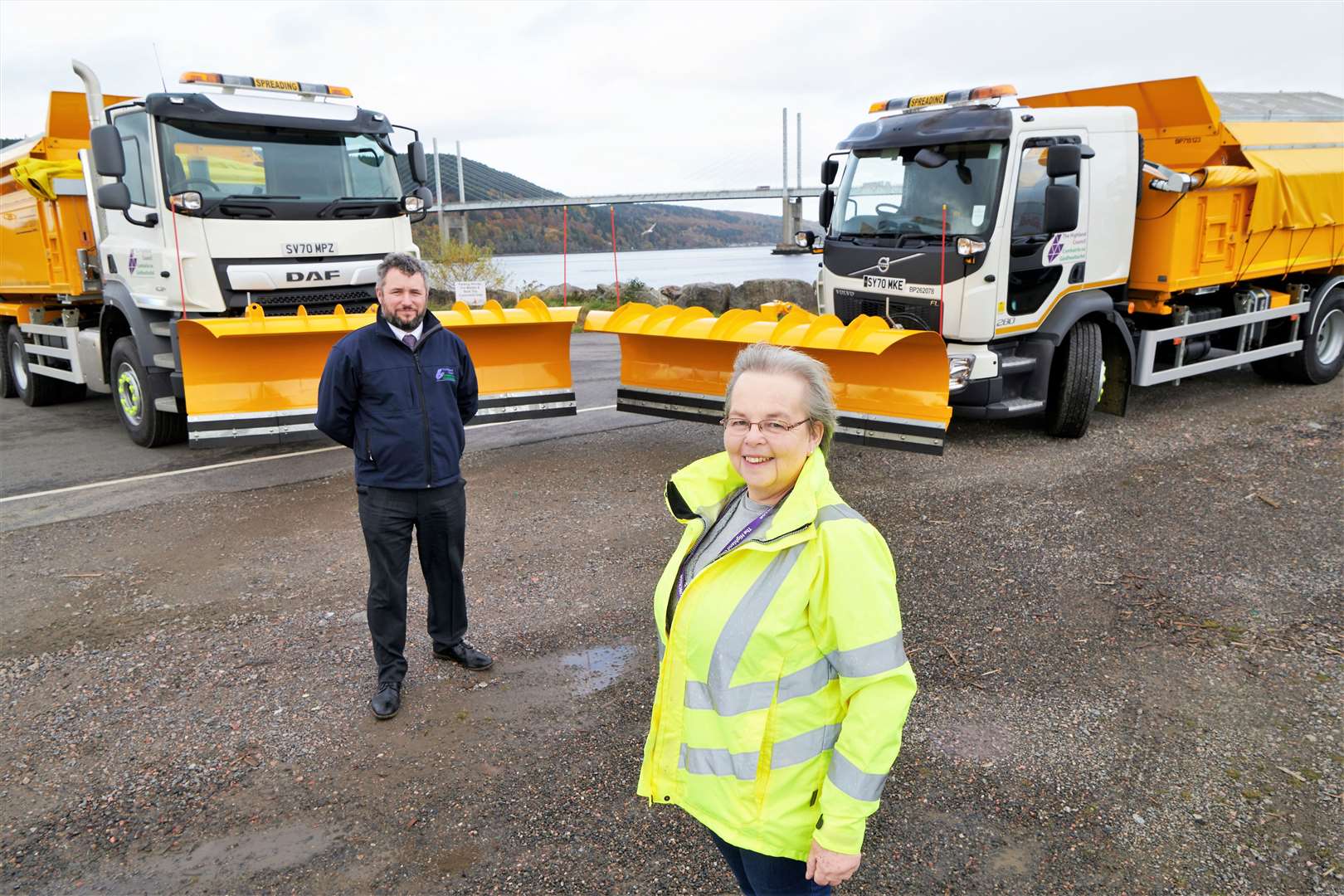 Councillor Trish Robertson and Mike Cooper of Highland Council with some of the new gritters purchased last year.