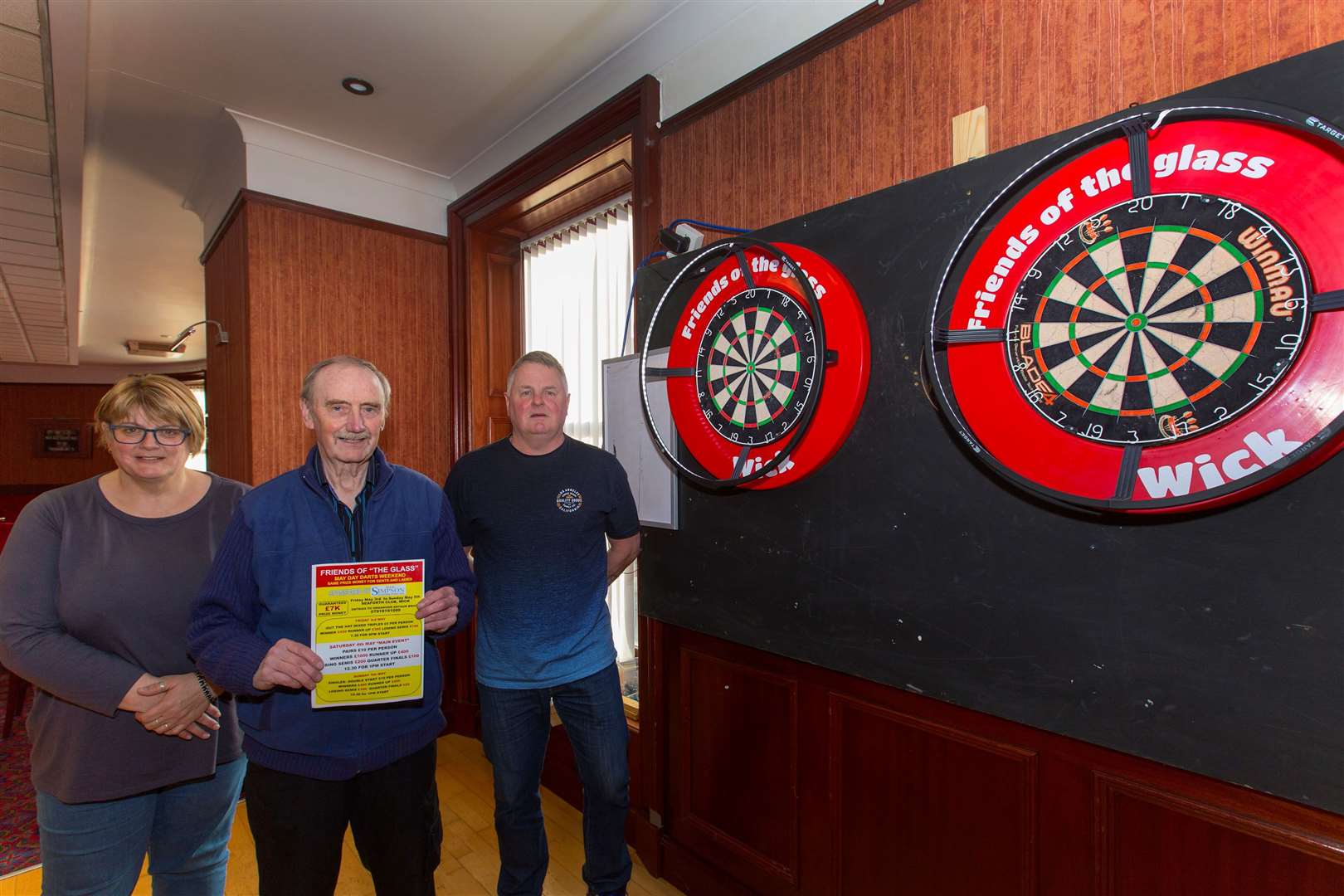 Liz Ronaldson, Malcolm Begg (centre) and Arthur Bruce, three of the four organisers of the Friends of the Glass darts competition. Picture: Robert MacDonald / Northern Studios