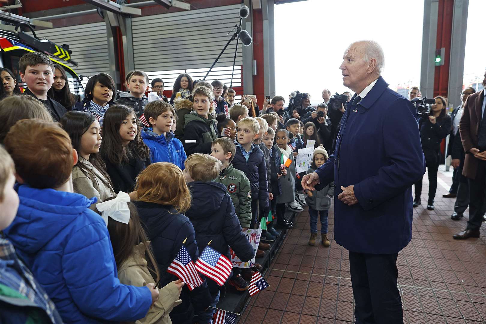 US President Joe Biden being greeted by family and friends of US Embassy staff after arriving at Dublin Airport (Julien Behal/PA)