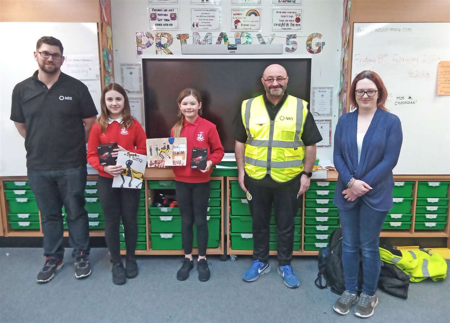 Dounreay's James Steven (left), Robert Macleod and Heather Fairweather with Noss pupils Mae Whitelaw and Leah Mackay who were joint winners of the competition.