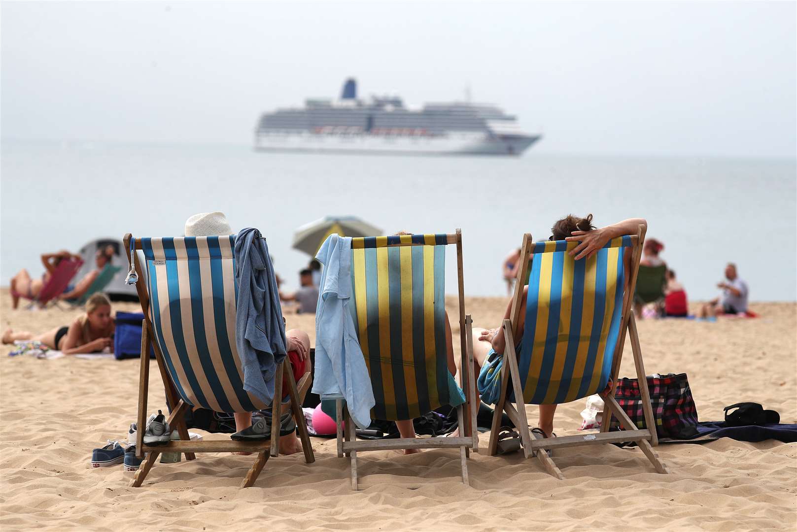 People enjoy the hot weather on Boscombe beach in Dorset, on August 8 (Andrew Matthews/PA)