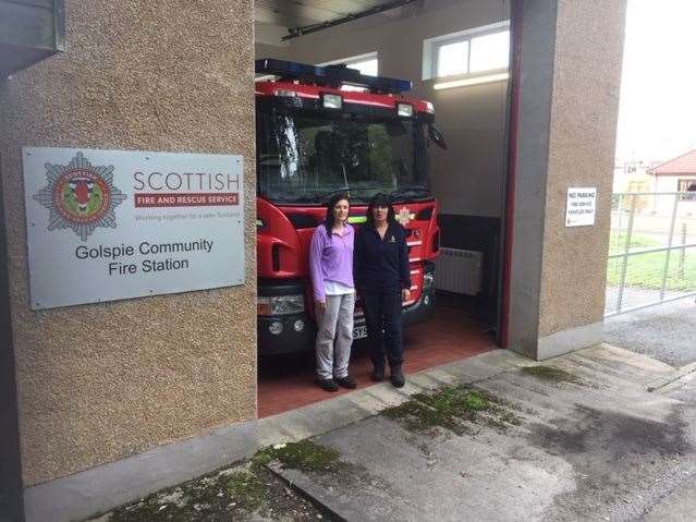 Julie Bain (left) and Karn MacGregor at Golspie fire station. The two charity walkers visited several fire and coastguard stations along the route north.