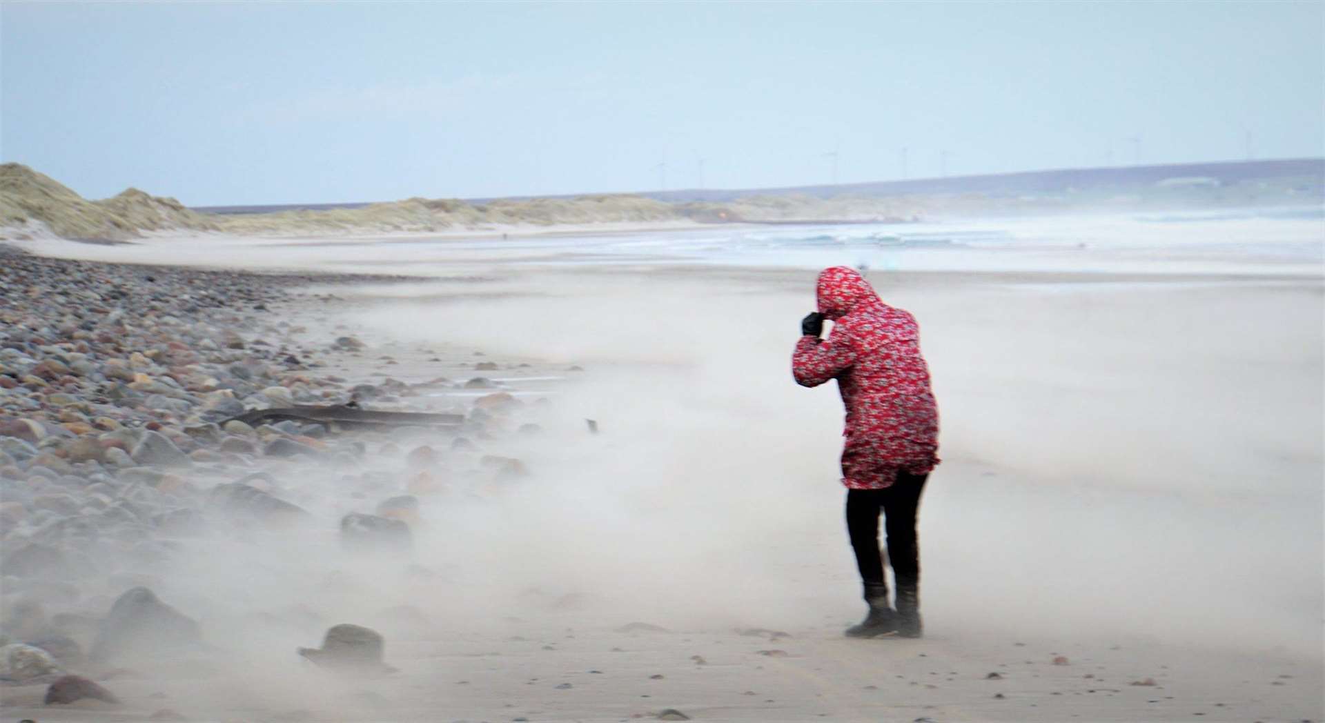 Windy weather on Reiss beach as a Groat reporter's hat gets blown away by Storm Ciara at bottom left. Picture: DGS