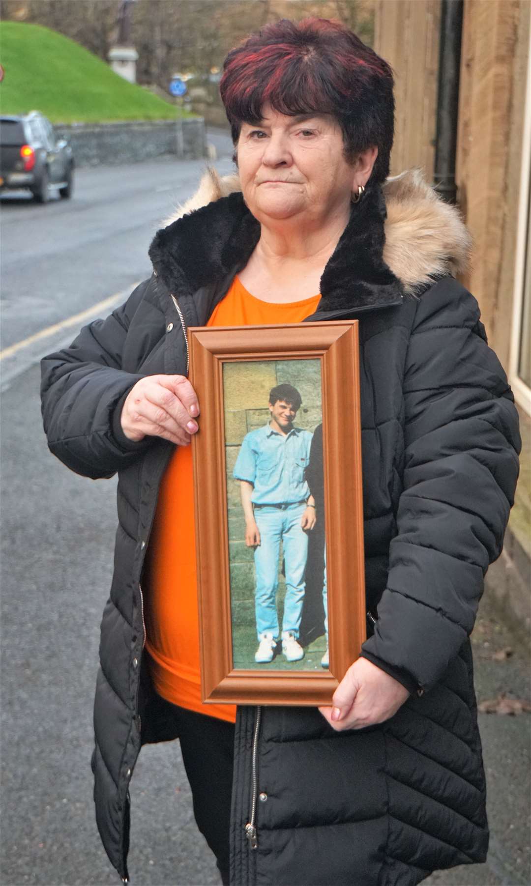 June McLeod holds a portrait of her son Kevin who tragically died in 1997. Picture: DGS