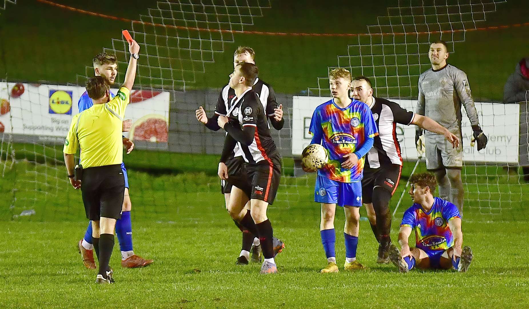 Referee Stuart Randall shows the red card to Wick Academy's Ryan Campbell for a foul on Ben Kelly on the edge of the penalty area. Picture: Mel Roger