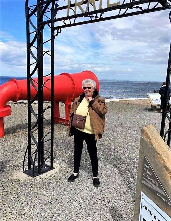 Hugh took a picture of Carol underneath the new arch at John O'Groats and then asked her to take a shot of him.