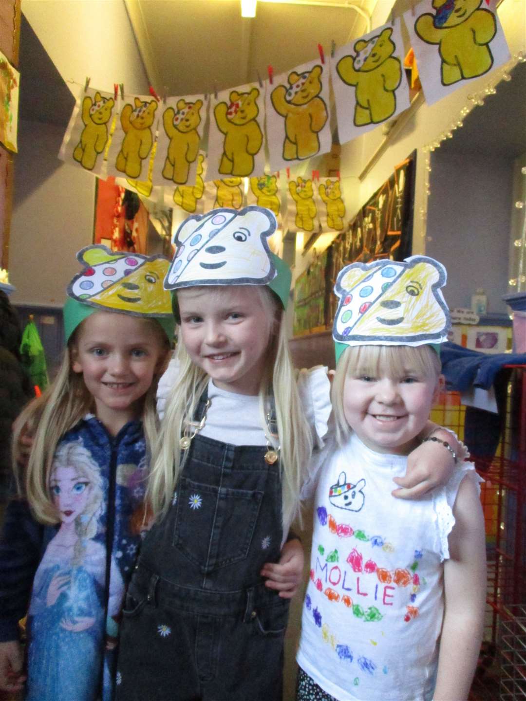 Friends with their Pudsey masks.