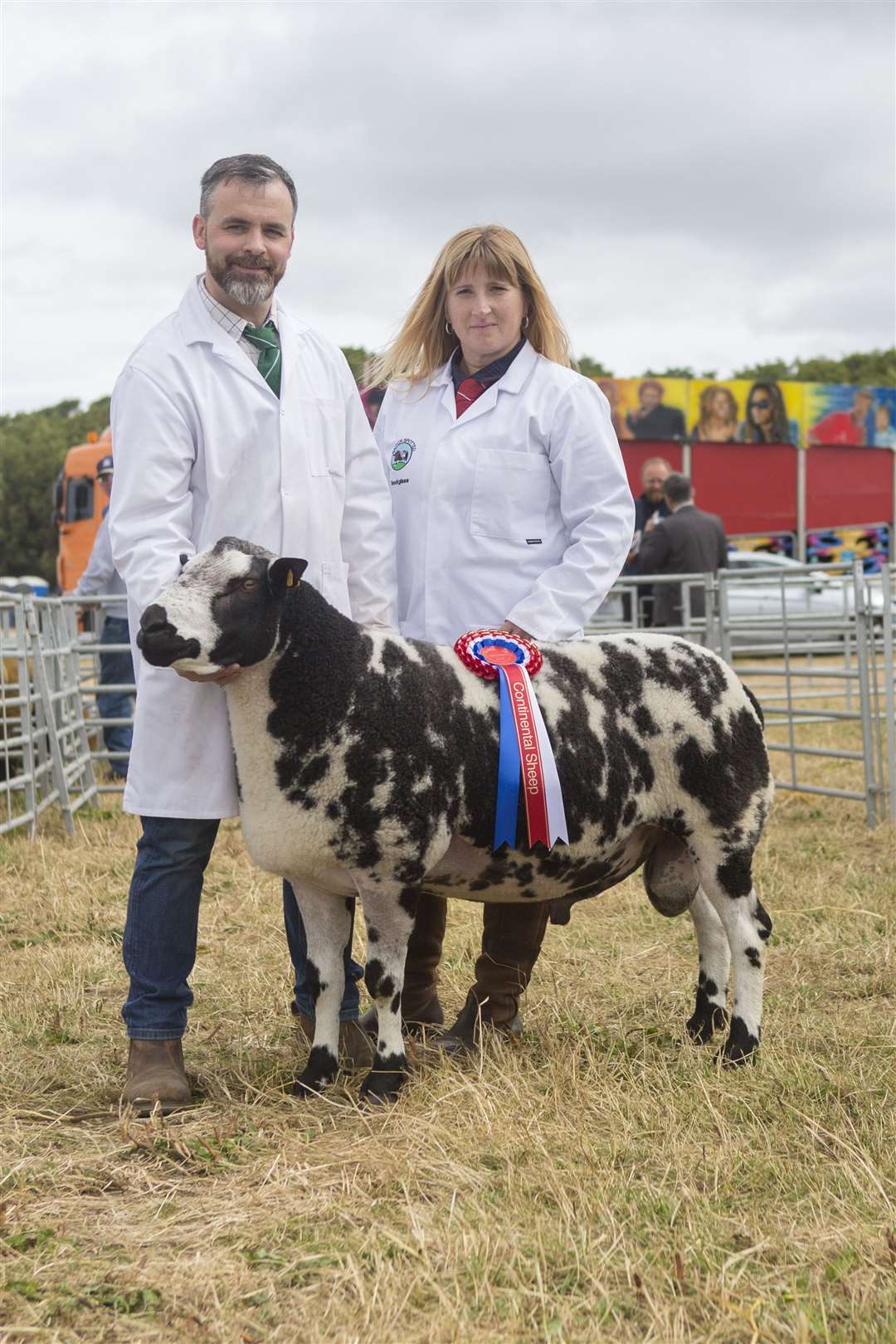 James and Anne Budge, Knockglass Farm, with their continental champion, Knockglass Dutch Courage, a two-year-old Dutch Spotted tup by Merryboro Cracker. Picture: Robert MacDonald / Northern Studios