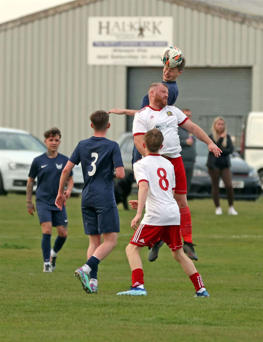 James Mackintosh of High Ormlie Hotspur beats Halkirk's Mark Mackay in the air. Picture: James Gunn