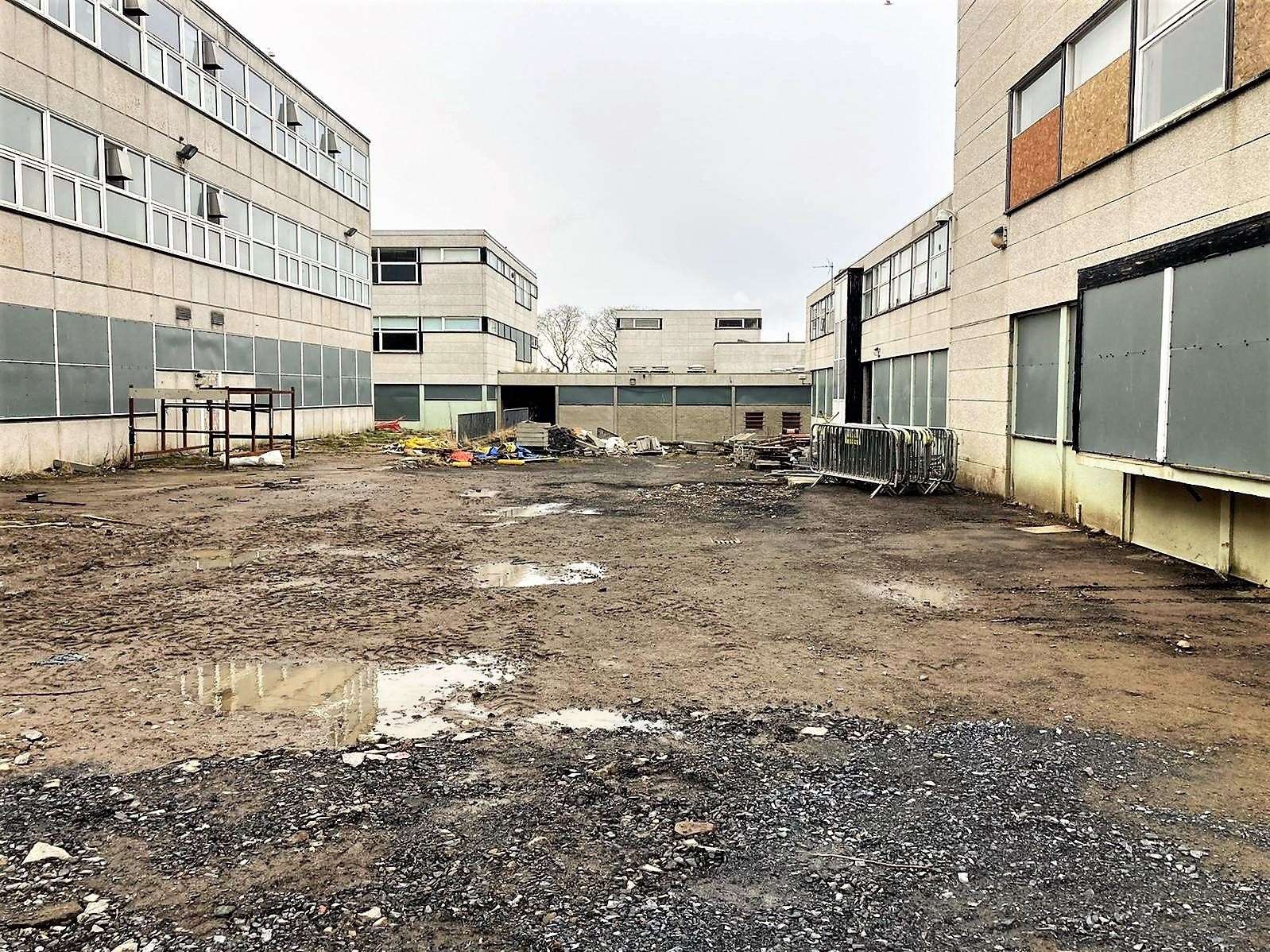 The path leading to Wick High School skirts by the old school which is in a dilapidated condition. Picture: Iain Baikie