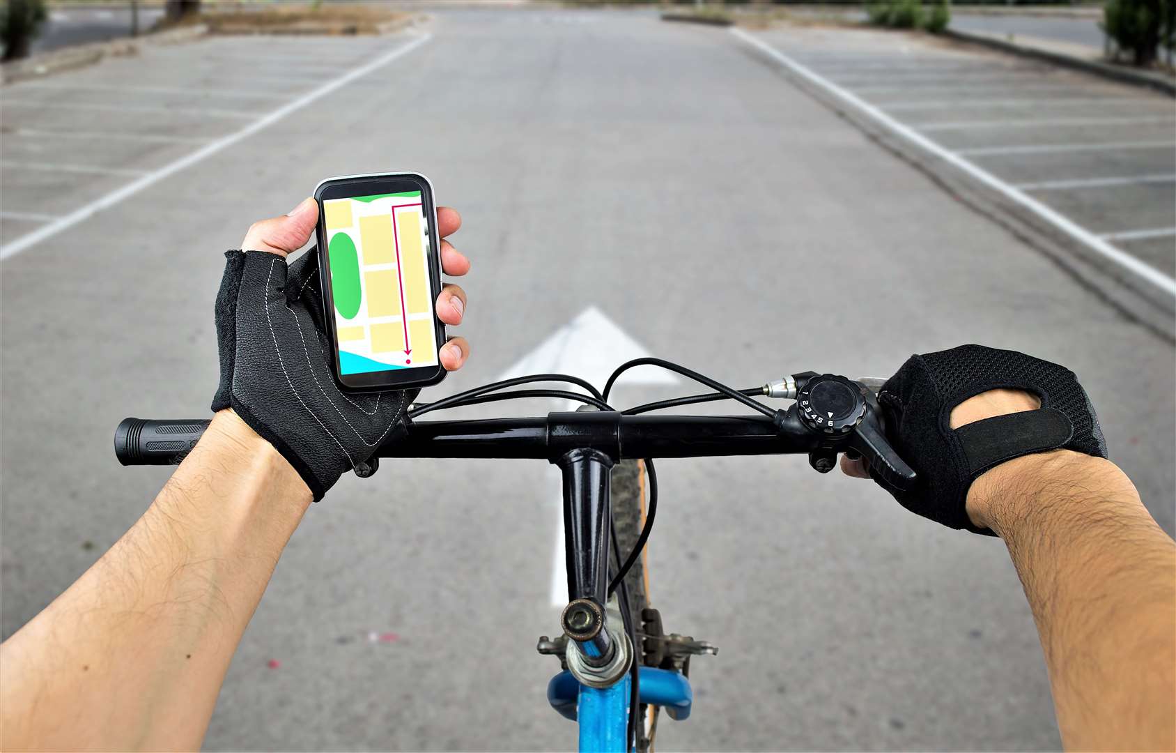 Cyclist using a mobile phone while travelling. Picture: Adobe Stock