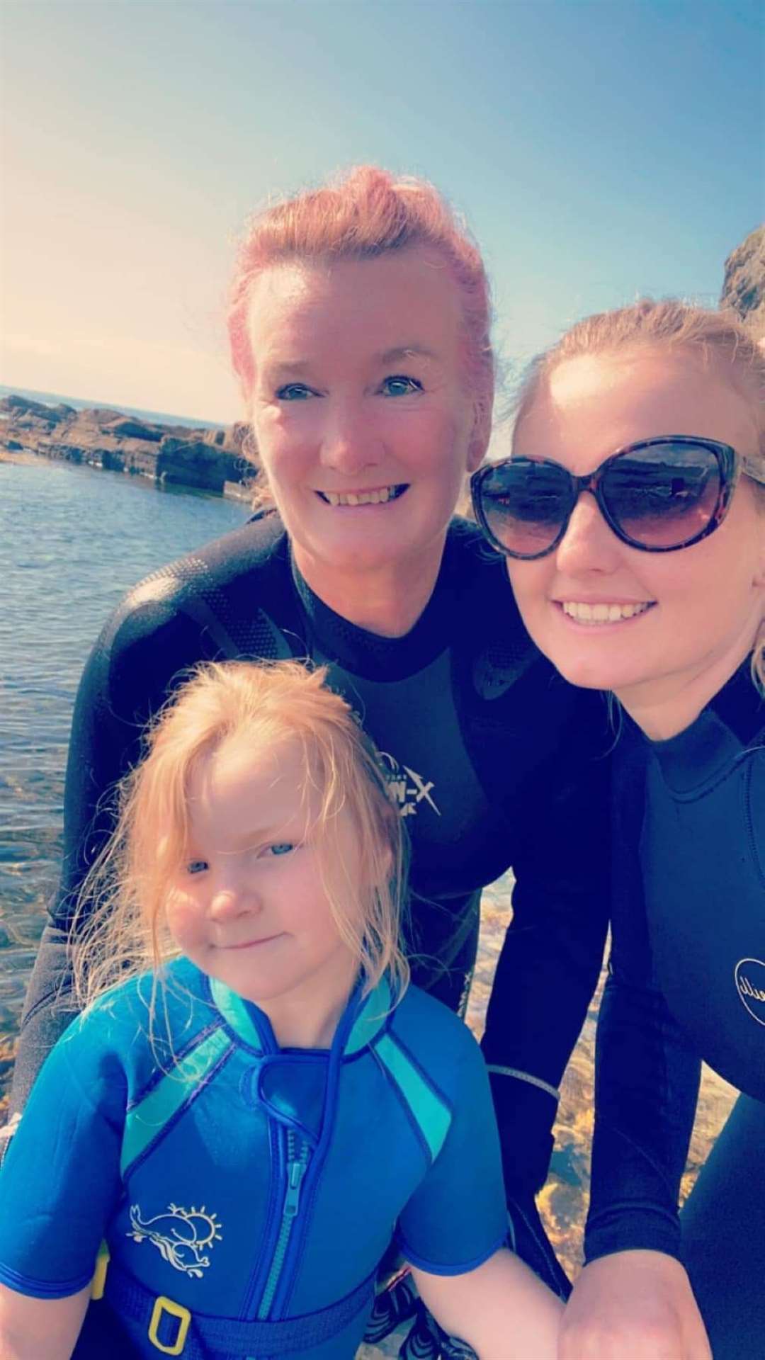 Lesley (left), daughter Erica and grand-daughter Olivia at Staxigoe harbour on the final day of the swim