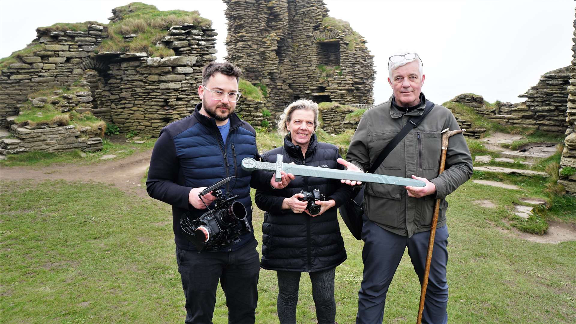 From left, Nathan Newman and Lois Stevenson from Pathway next to author Shawn Williamson who wrote historical fantasy novel Questus that features Sinclair-Girnigoe Castle in Caithness. Picture: DGS