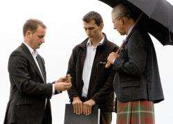 Andy Heald (left) shows Prince Charles a 2000-year-old bone handle found at the dig. Looking on is Dr Graeme Cavers.