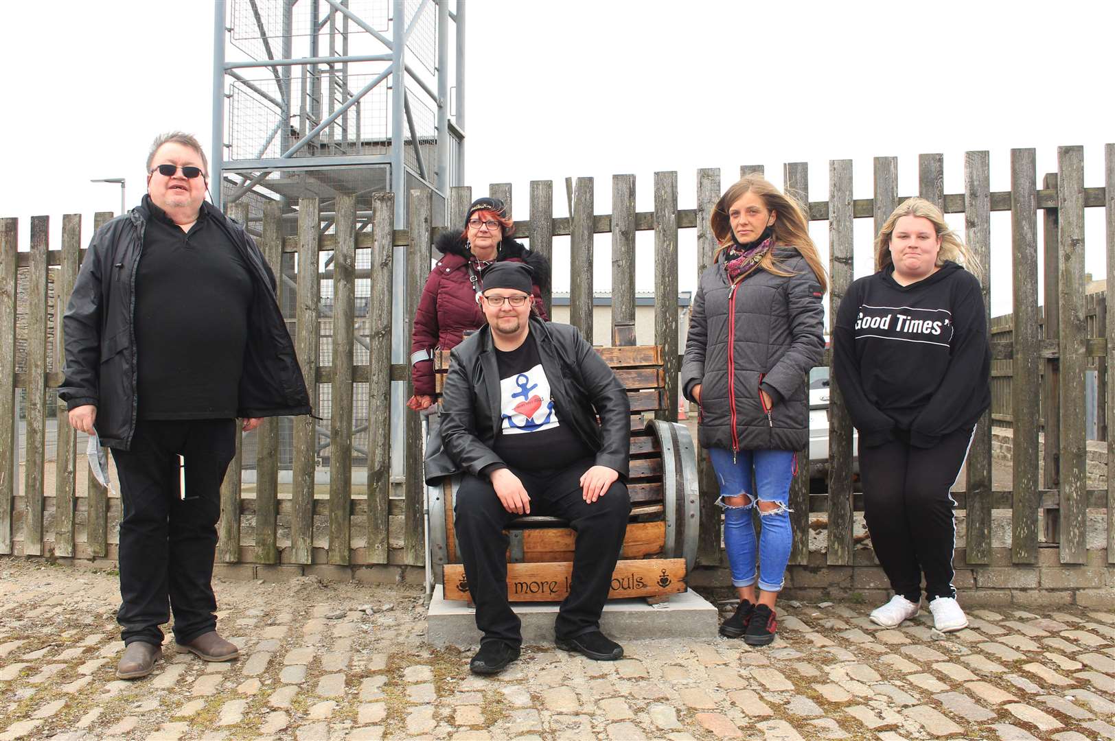 Some of group at the memorial bench on Saturday. The Rev John Nugent (left) said a prayer and gave thanks for the lives of those who have been lost. Picture: Alan Hendry