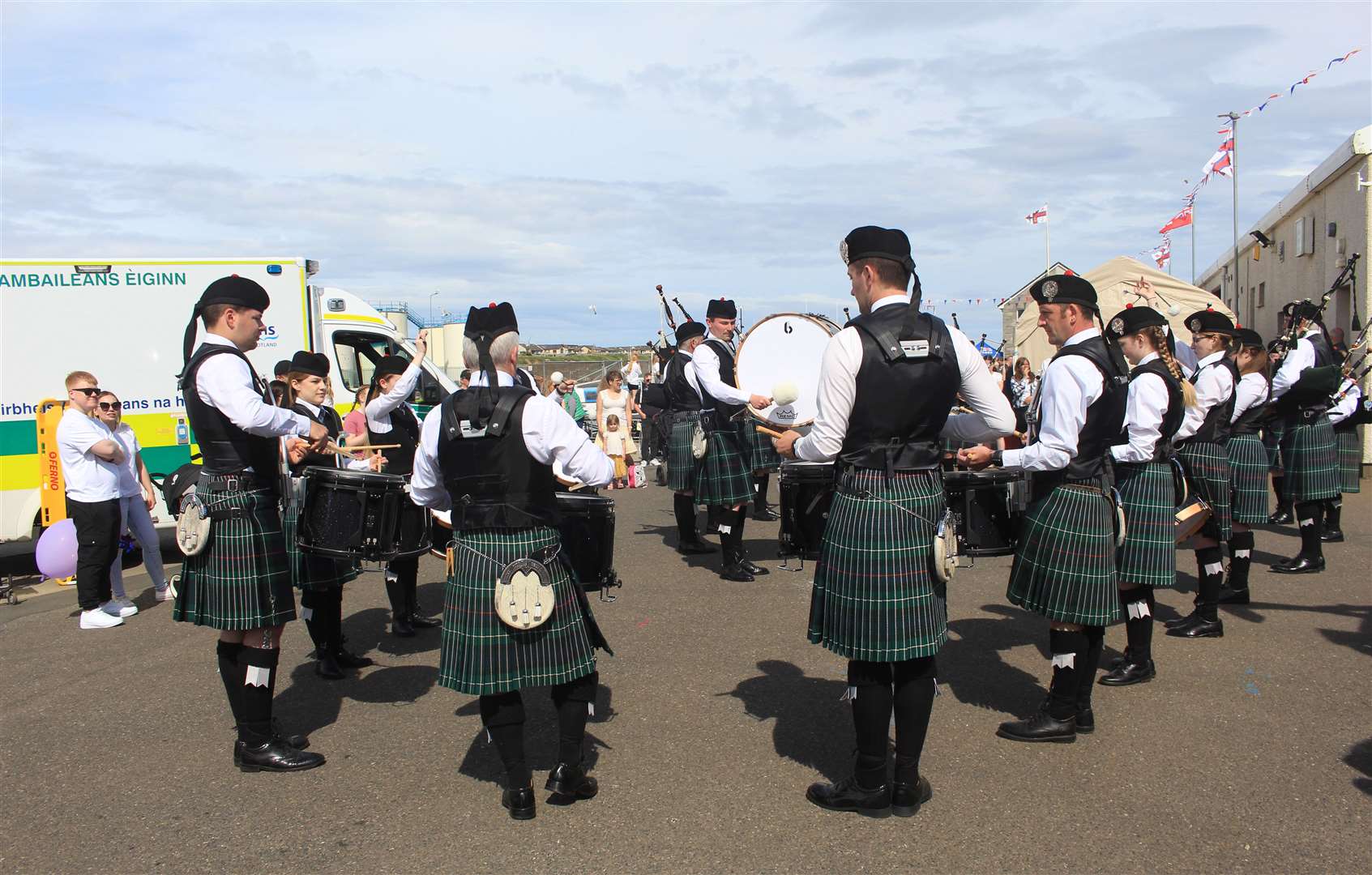 Wick RBLS Pipe Band playing on the quayside. Picture: Alan Hendry