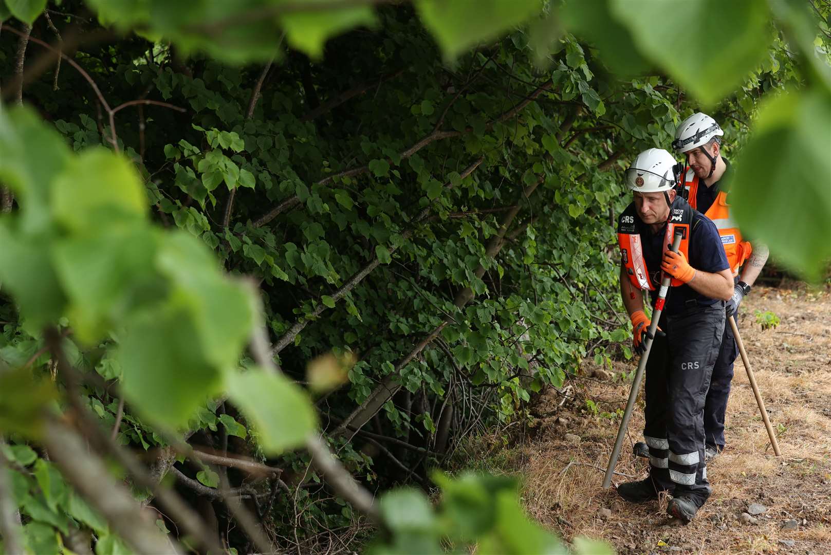 Community Rescue Service volunteers in thick undergrowth near the River Braid in Ballymena (Liam McBurney/PA)