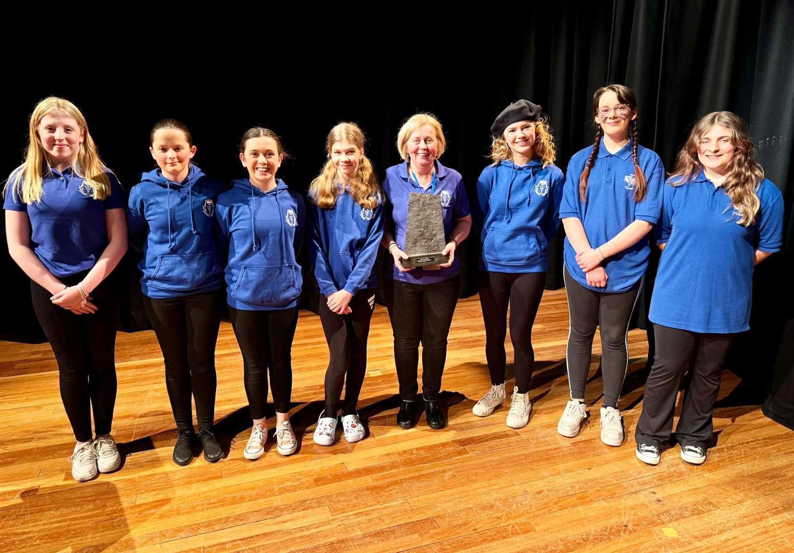 The Wick juniors and director Frances Yellop after being presented with the Halkirk Drama Club Trophy.