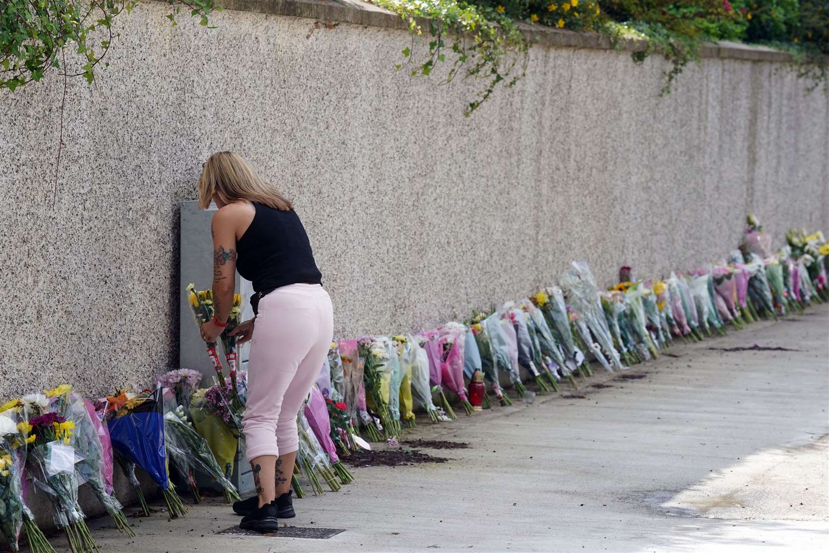 Flowers and tributes left at the wall outside Loreto in Clonmel (Brian Lawless/PA)