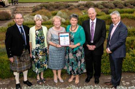 The Forres in Bloom team with the award.