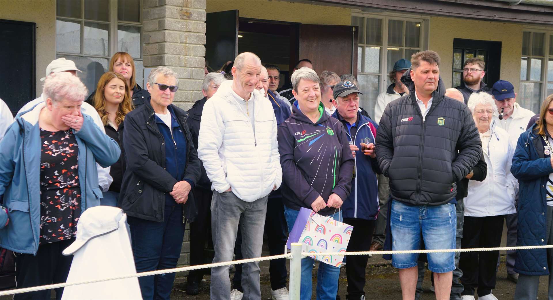 Bowling club members listen intently as the president delivers his speech. Picture: DGS