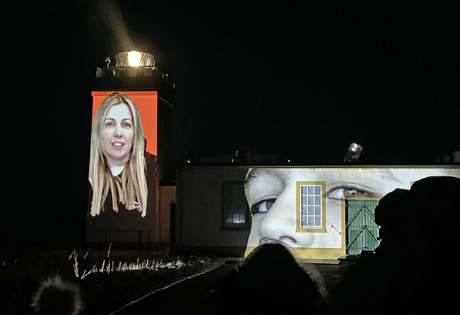 Faces from the John O'Groats area are projected onto the lighthouse at Duncansby. Picture: Mike Bullock