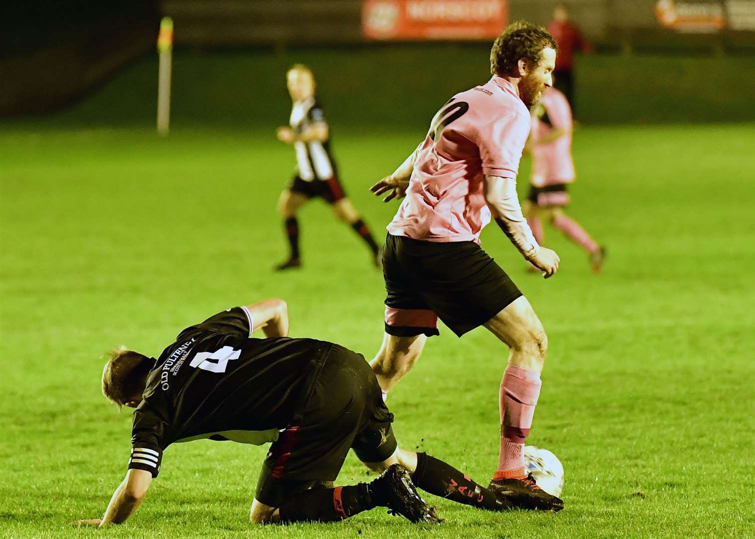 A sore one for Academy captain Alan Farquhar as Clach's Scott Graham appears to stand on his ankle. Picture: Mel Roger