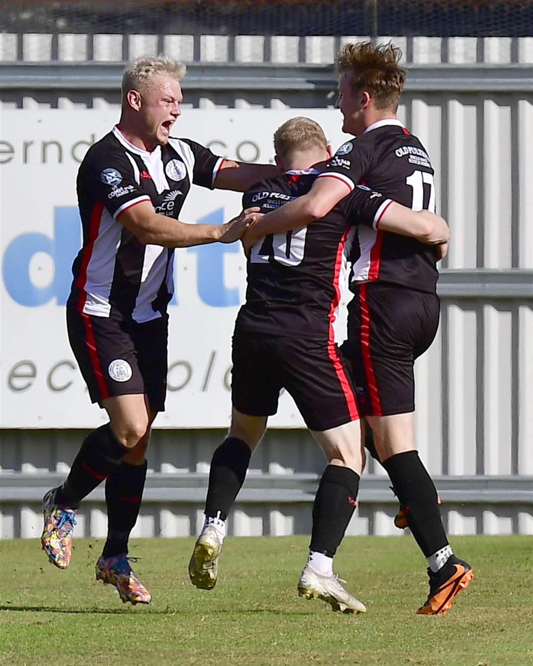Jack Halliday with Alan Hughes and Mark Macadie after Macadie had scored Wick's winning goal in a 2-1 win against Strathspey Thistle at Seafield Park in August 2022. Picture: Mel Roger