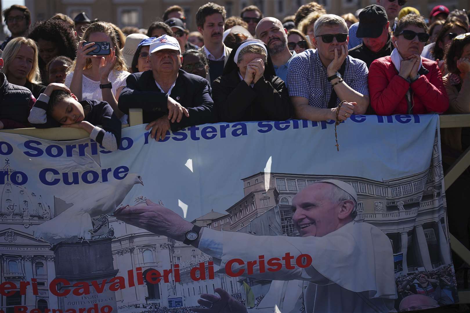 Mourners listen to the funeral mass, part of an estimated congregation of 200,000 (Emilio Morenatti/AP)
