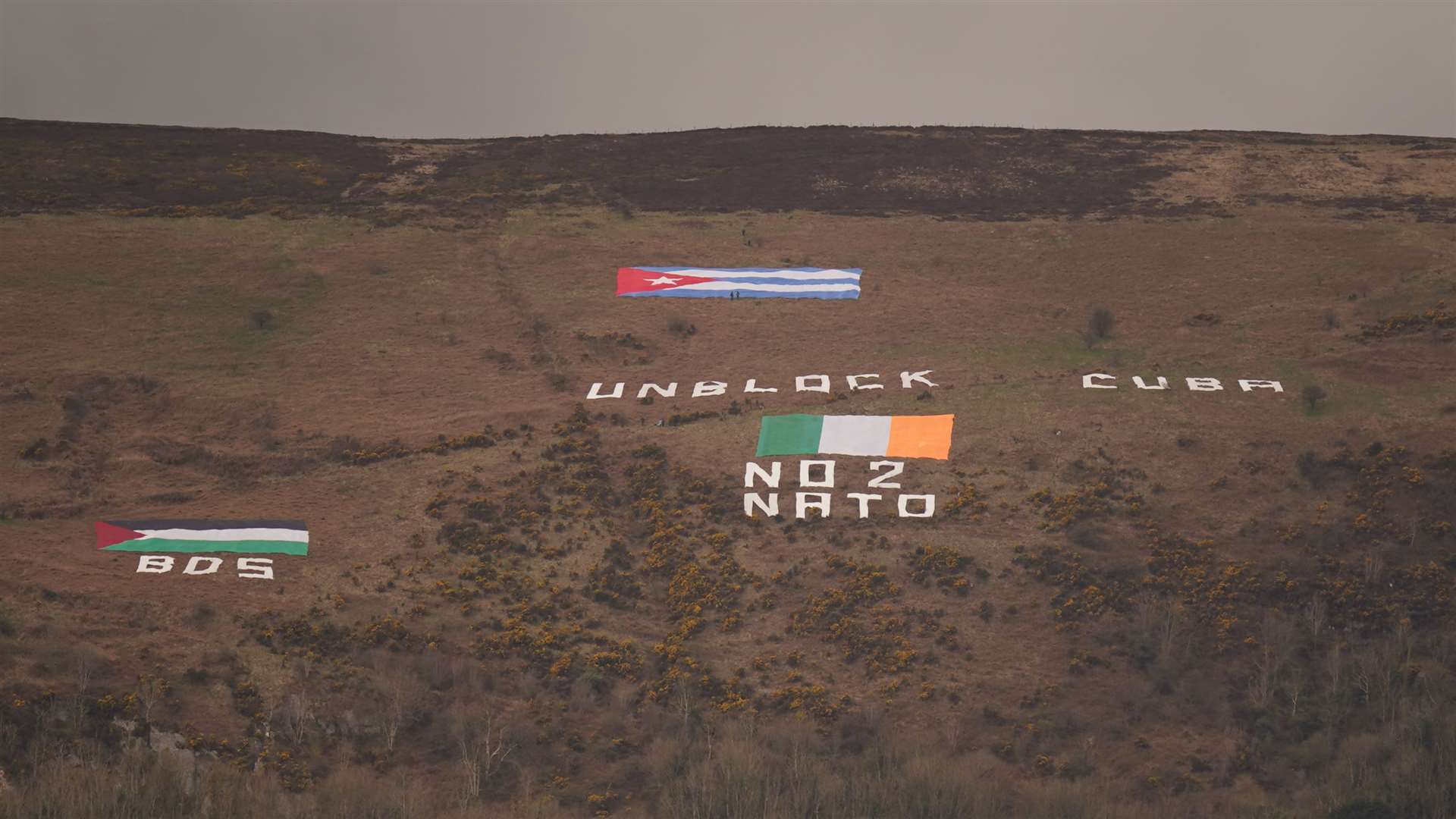 Messages are displayed on Black Mountain which overlooks the city of Belfast (Niall Carson/PA)