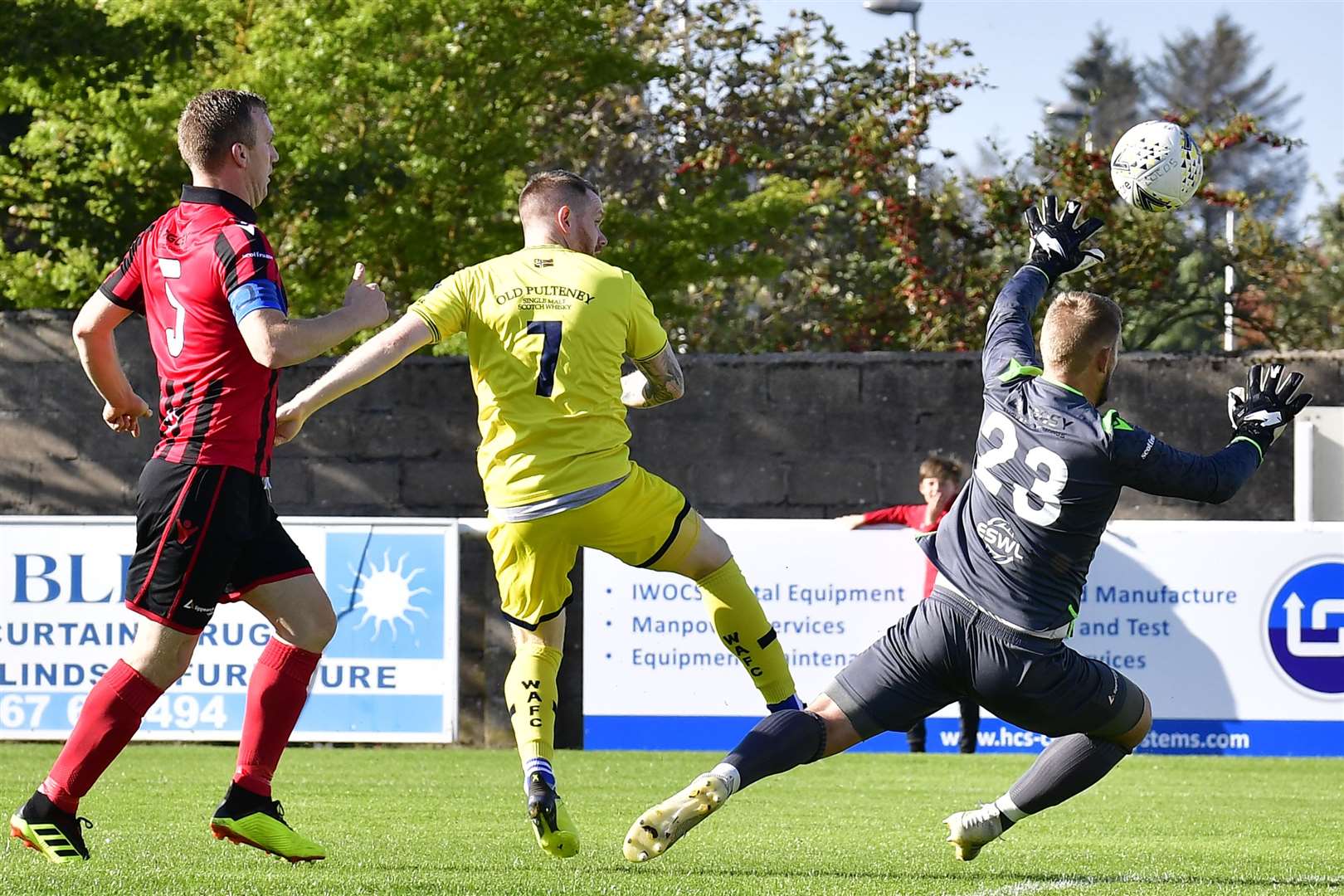 Craig Gunn flicks the ball over outstretched arms of Inverurie keeper Andy Reid for Wick's opening goal. Picture: Mel Roger