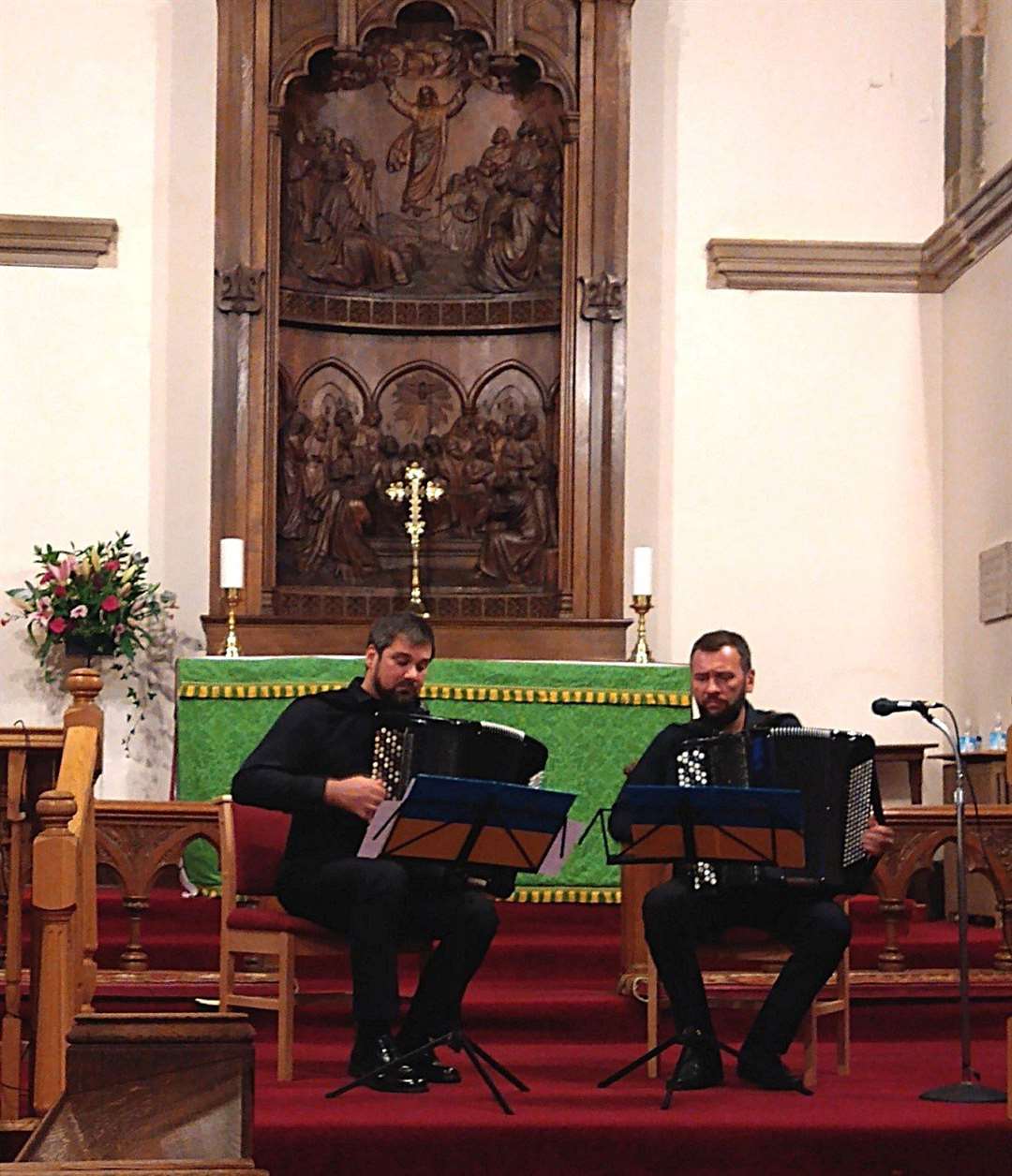 Igor Sayenko and Oleksii Kolomoiets – the Kyiv Classic Accordion Duo – during their performance at St Peter and the Holy Rood Episcopal Church in Thurso.