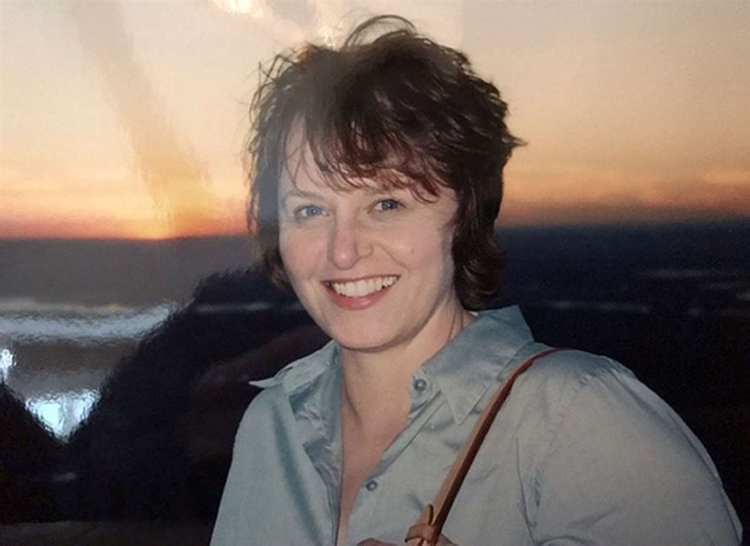 Janice Brooks pictured on top of Two World Trade Centre on September 7, 2001 just four days before the attacks (Janice Brooks/PA)