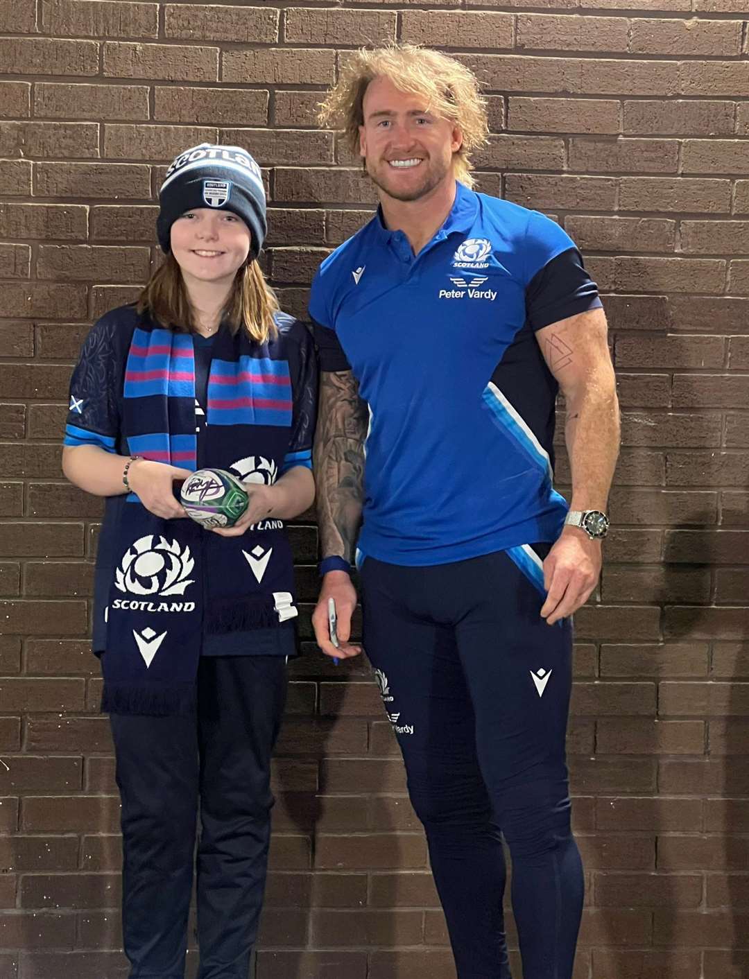 Erin Sutherland with Scotland player Stuart Hogg.