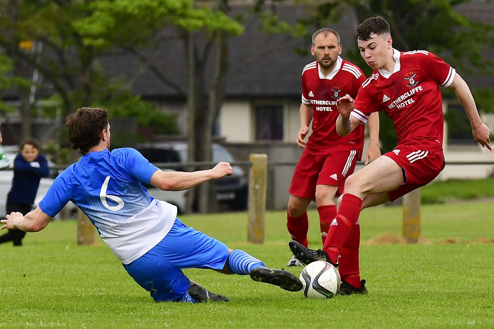 Wick Thistle's Steven Sutherland challenges Conor Farquhar of Wick Groats. Picture: Mel Roger