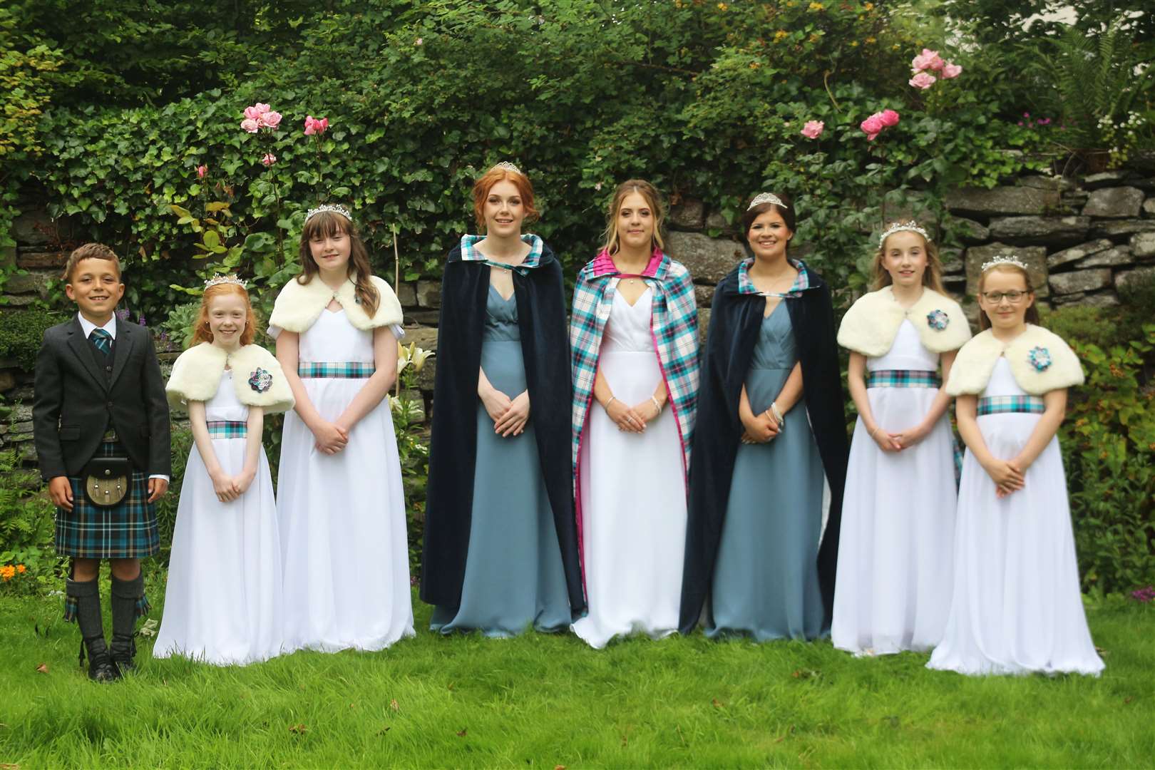 Wick gala queen Beth Dunnett with her attendants Devin Stuart and Lauryn Miller and the gala court. Picture: Eswyl Fell