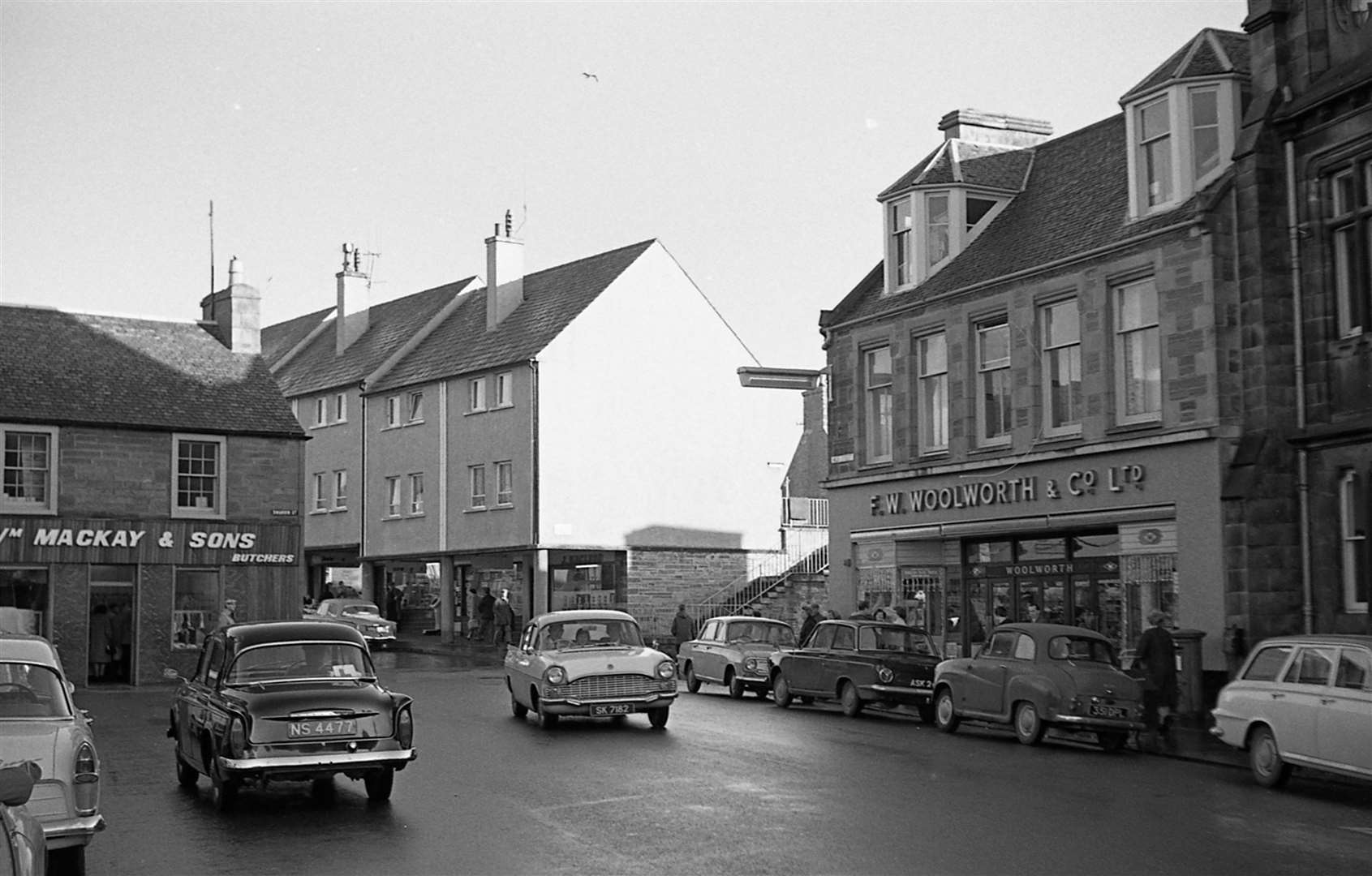 High Street, Thurso, in the 1960s, with Woolworths on the right and and W Mackay & Sons' butcher shop on the left. Picture: Jack Selby Collection / Thurso Heritage Society
