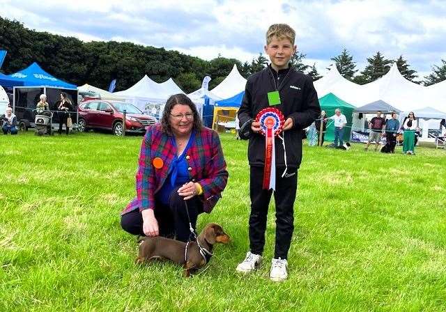 Danny Macdonald and his 11 month old miniature dachshund won first in 'Dog the Judge would like to take home' and Best Overall in the Novelty Section. Picture supplied