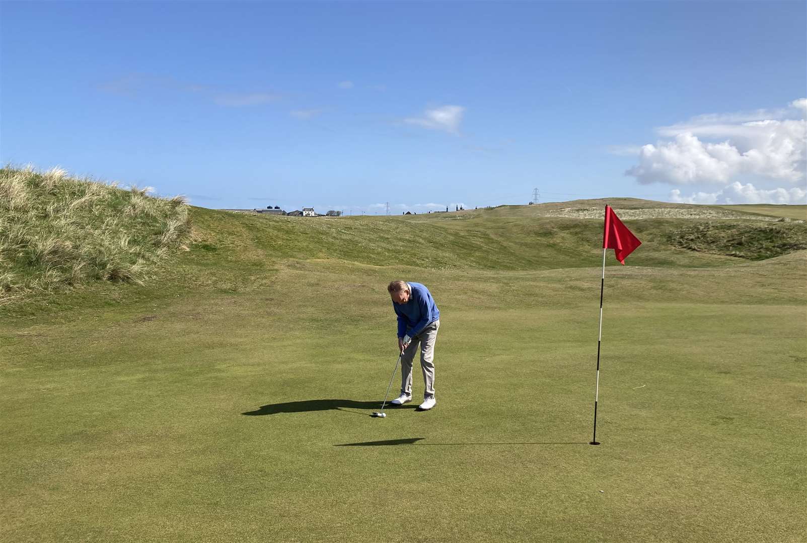 Murdo Macdonald putting at the 13th on the Reay links.