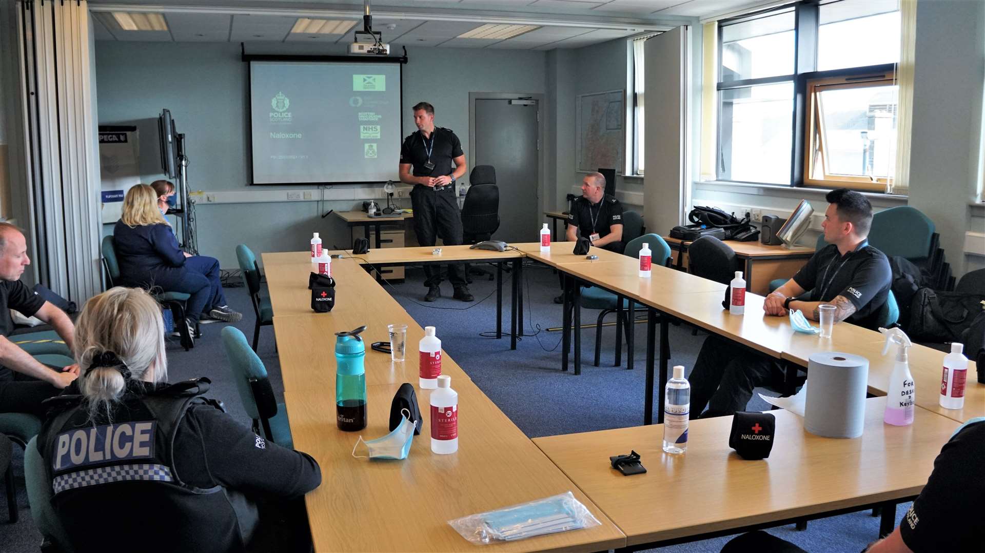 Officers and drug specialists in the conference room of Wick police station for the Naloxone training session on Monday afternoon.