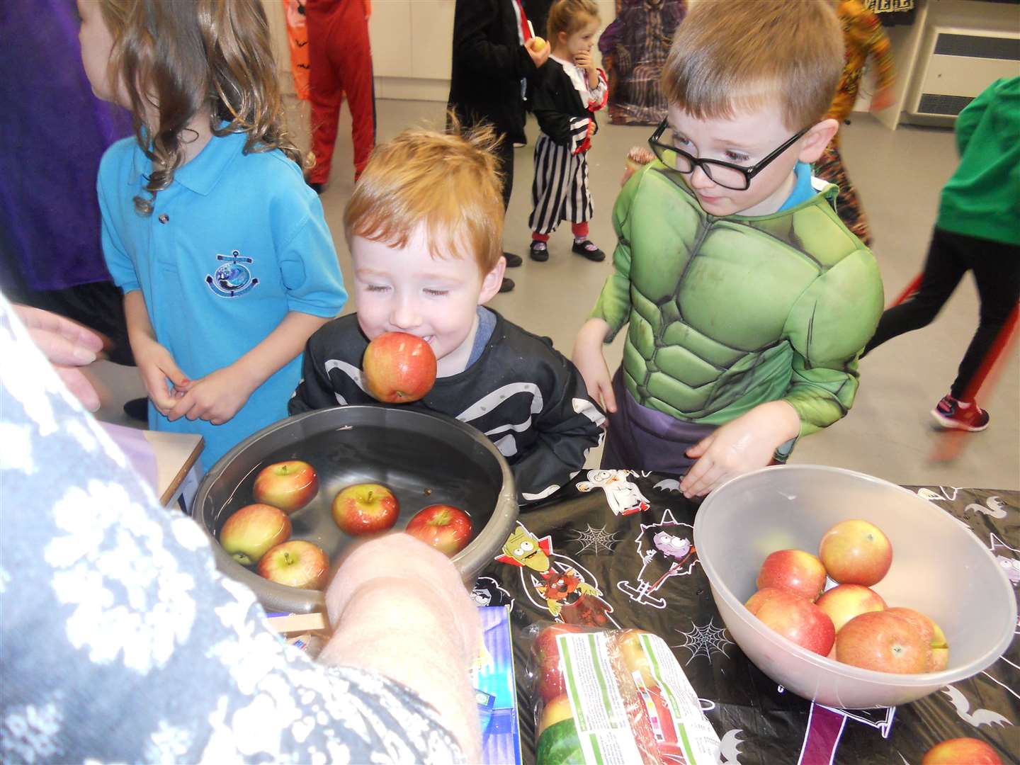 Nursery pupil Reuben Sweeting had a fun time dooking for apples, watched by P2 pupil Connor Crossley.