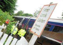 A report demands major safety improvements at open level crossings