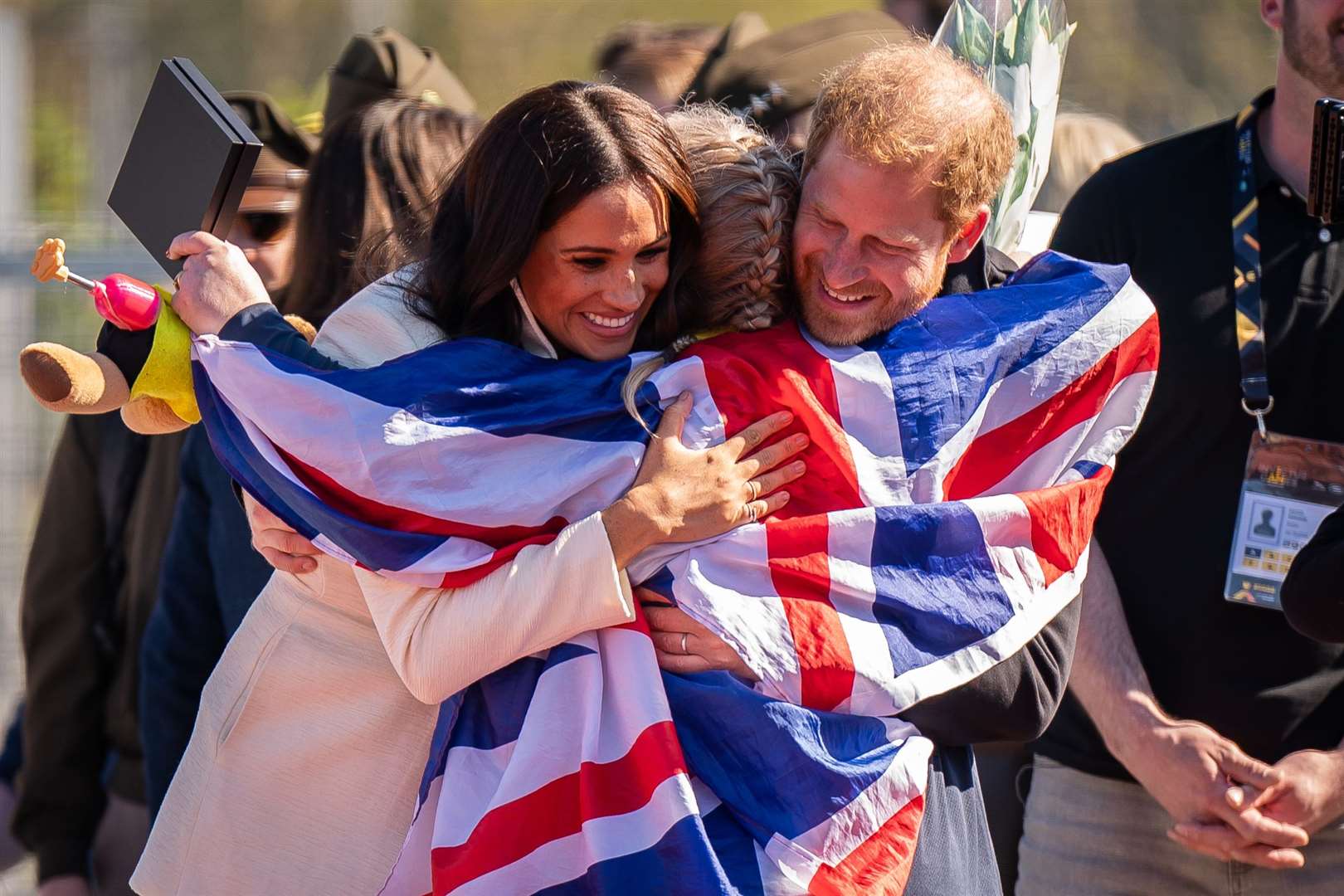 The Duke and Duchess of Sussex hug Team United Kingdom competitor Lisa Johnston during the Invictus Games last year (Aaron Chown/PA)