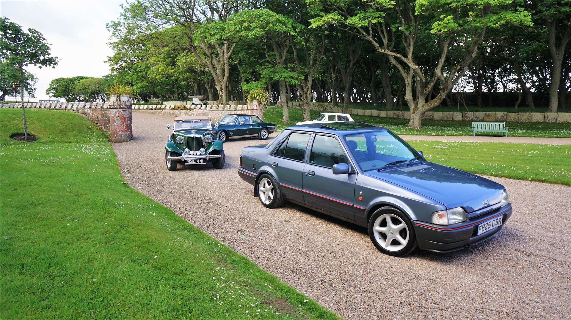 Cars from different eras turned up yesterday such as the 1980s Ford Orion at front. Picture: DGS