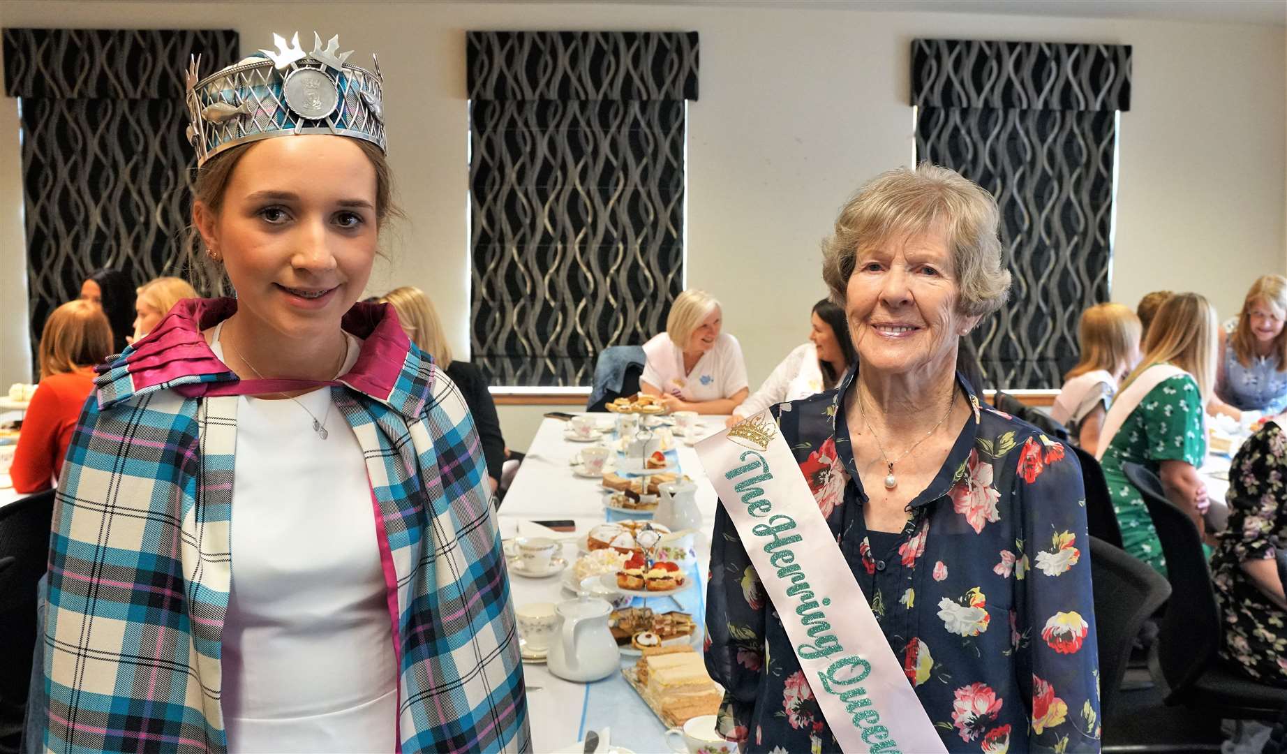 The present gala queen Abby Dunbar is pictured with the oldest queen at the event, Ray Richard, who was actually crowned as a 'herring queen' in 1949 before the title changed. Picture: DGS