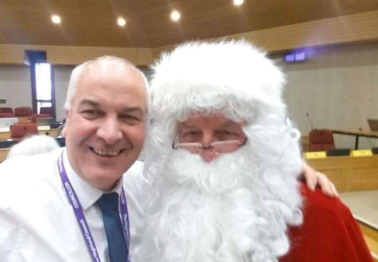Choir conductor Raymond Bremner is joined by Santa (Willie Mackay).
