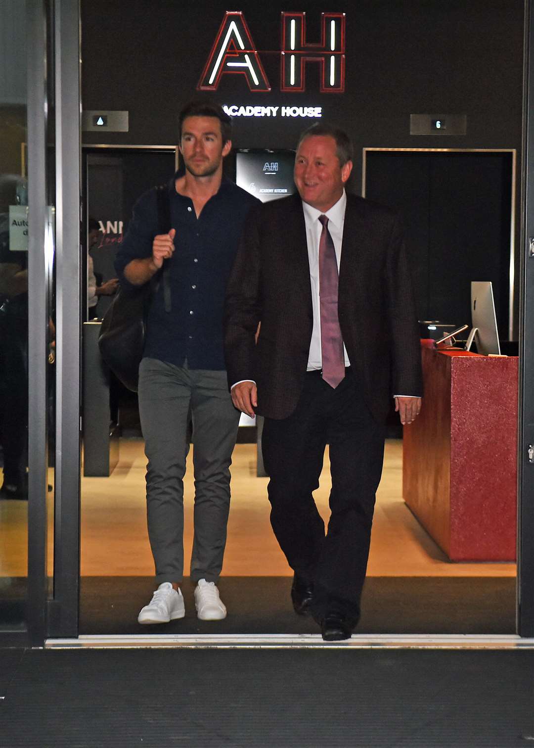 Mike Ashley leaves the Sports Direct headquarters in London with his future son-in-law, Michael Murray (left) (Kirsty O’Connor/PA)